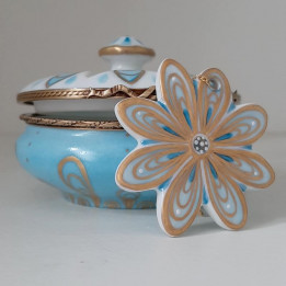 Porcelain jewelry box with blue and gold flower necklace -