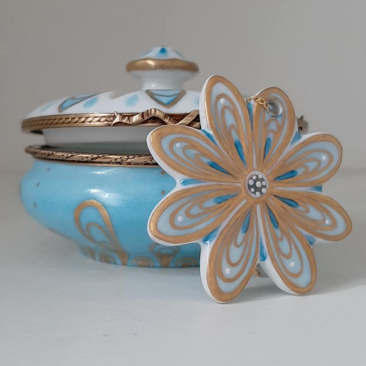 Porcelain jewelry box with blue and gold flower necklace -