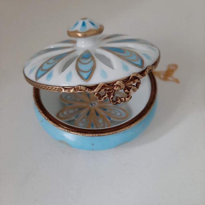 Porcelain jewelry box with blue and gold flower necklace -